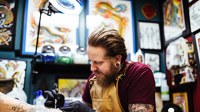 Artist and shop owner Jedidia Reid at his Element Tattoo Studio.