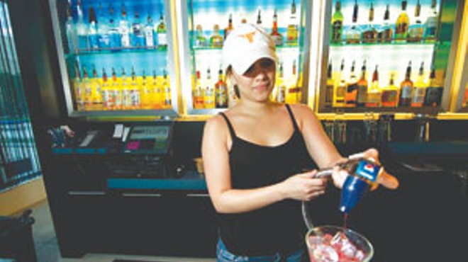 Bartender Meagan Ochoa mixes a drink at Wxyz Bar in the Aloft Hotel.