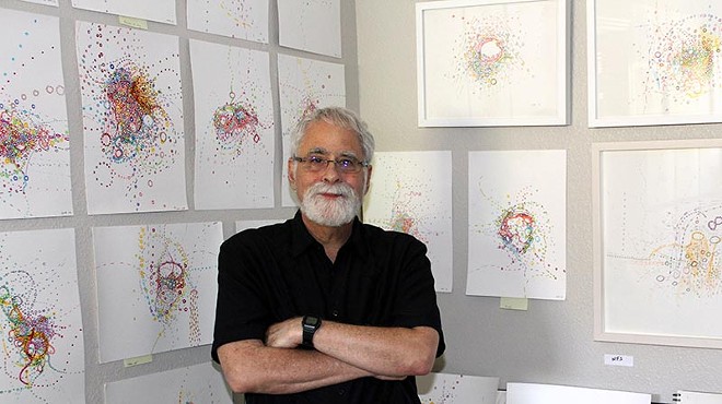 David Rubin among his stacks of "automatic drawings"