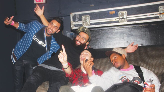 Fan poses with Das Racist’s Victor Vasquez and guest rappers Lakutis and Houston’s Fat Tony.