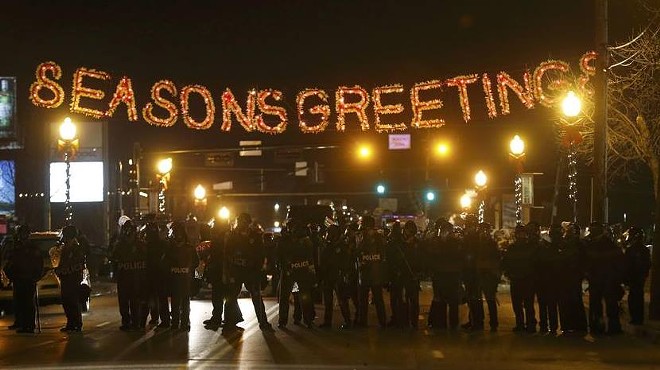 Law enforcement wearing riot gear in Ferguson, MO on Monday, November 24, 2014. Protesters clashed with police following the announcement that a grand jury decided not to indict Officer Darren Wilson for the fatal shooting of Michael Brown.