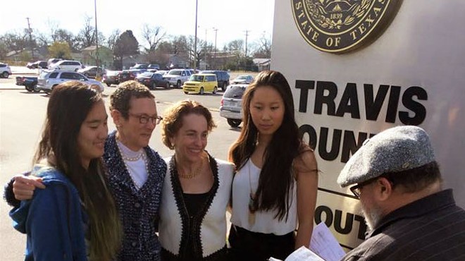 Sarah Goodfriend and Suzanne Bryant, shown here with their daughters Dawn and Ting, became the first same-sex couple to be legally wed in the Sate of Texas on Thursday.