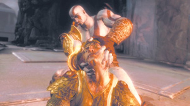 God of War III's Kratos, tearing off the head of Helios, the sun god.