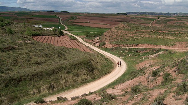 Pilgrims Misa and William walk a stretch of the Camino that passes through La Rioja in Spain