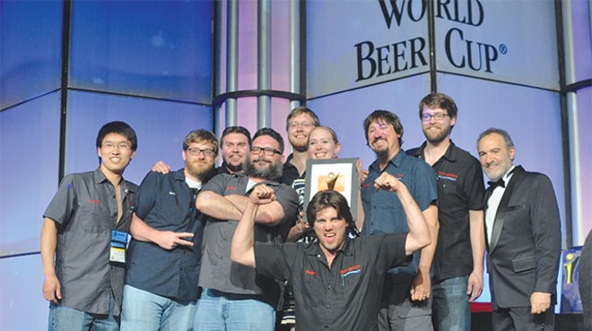 St. Arnold’s brew team accepts their bronze WBC award for their Santo dark lager