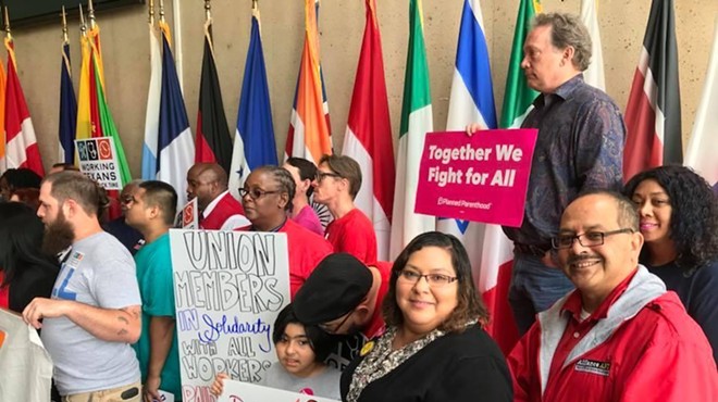 Workers and activists at a recent AFL-CIO Texas rally show their support for mandated paid sick leave.