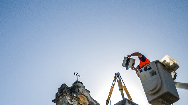 A CyArk worker uses digital scanning gear to capture images of the San Antonio Missions.