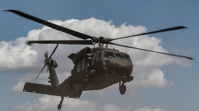 A U.S. Army Blackhawk helicopter takes off.