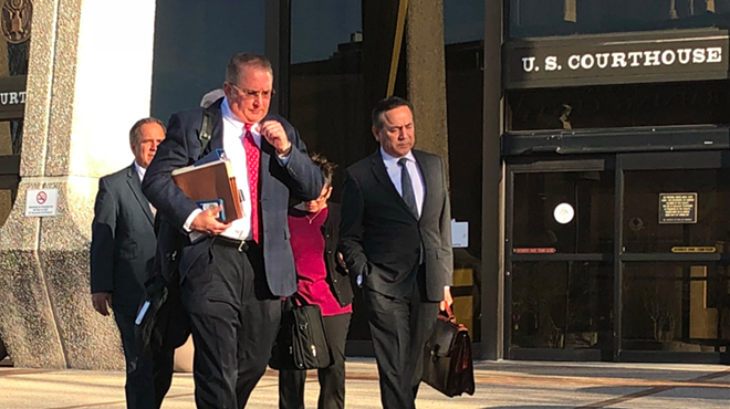 Uresti (right) leaves the federal courthouse with his legal team during his February 2018 trial.