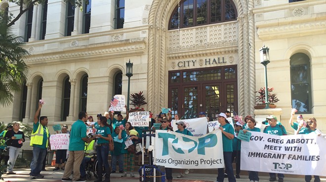 Members of the Texas Organizing Project gather outside of city hall during an immigration rally last year.
