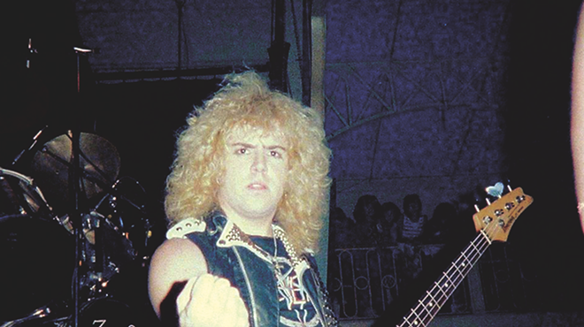 S.A. Slayer bassist and panelist Donnie Van Stavern pumps his fist in an early-'80s photo.