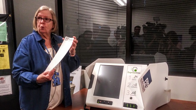 Bexar Elections Administrator Jacque Callanen displays a paper ballot produced by the county's new voting machines.