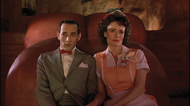 Diane Salinger as Simone and Paul Reubens as Pee-wee Herman in 'Pee-wee's Big Adventure.'