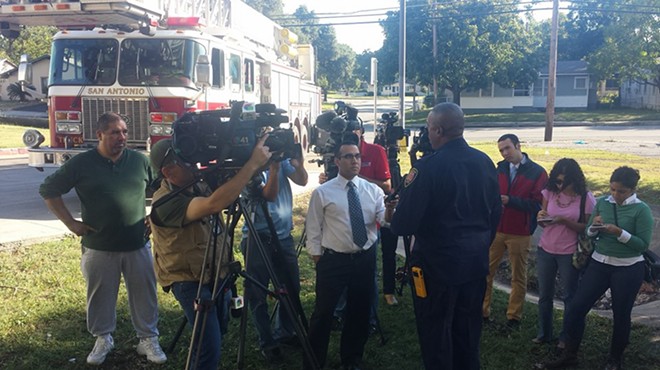SAFD Chief Charles Hood addresses media near the drainage ditch by Babcock and Fredericksburg roads where a 41-year-old man was swept away.
