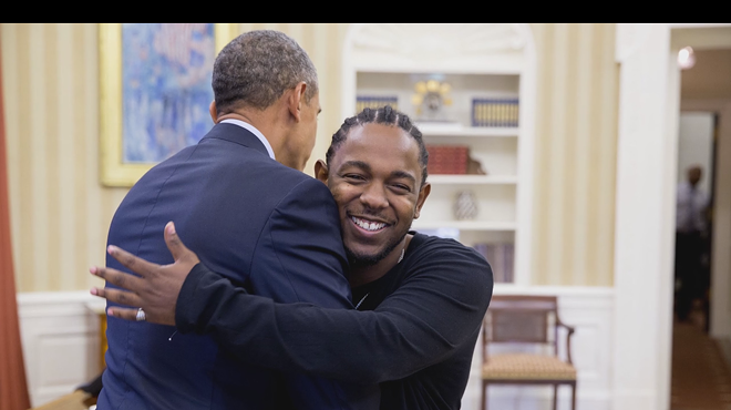 Lamar and Obama exchange thoughts and hugs in the Oval Office
