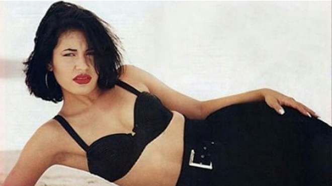 Selena's highly coveted look: red lips, dark locks, bustiers, and high-waisted pants.