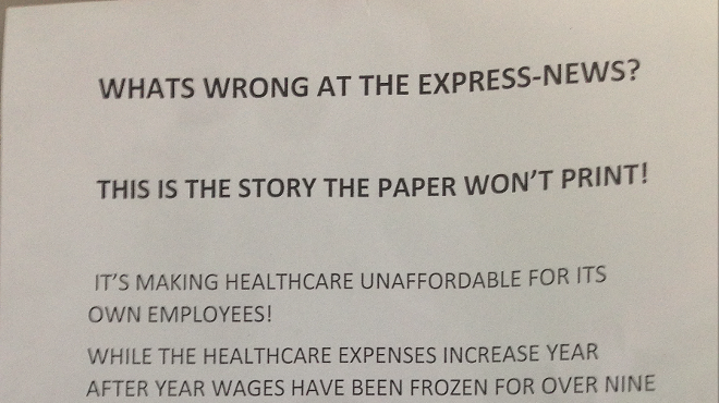 Press workers at the Express-News handed out this flier around the daily's downtown building Wednesday morning