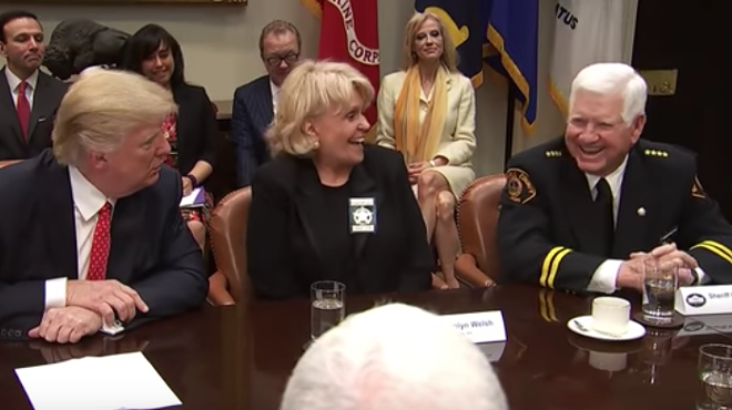 Sheriff Eavenson (right) laughs at President Trump's threat to fire a Texas senator Tuesday.