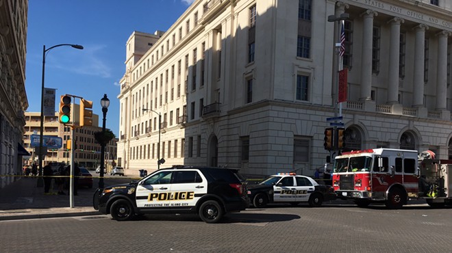 Police swarmed around the federal building downtown Wednesday afternoon