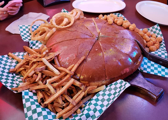 Big Lou’s Burgers isn’t just a name — it’s a way of life. If you’re at all skeptical, consider the Super Big Lou, a 12-pound burger, all the proof you need. The burger, made with a 6.5-pound patty topped with all the fixings, is intended to feed between eight and 10 people. The feast is also served with tater tots, fries and onion rings.
Photo via Instagram / kook.delarosa