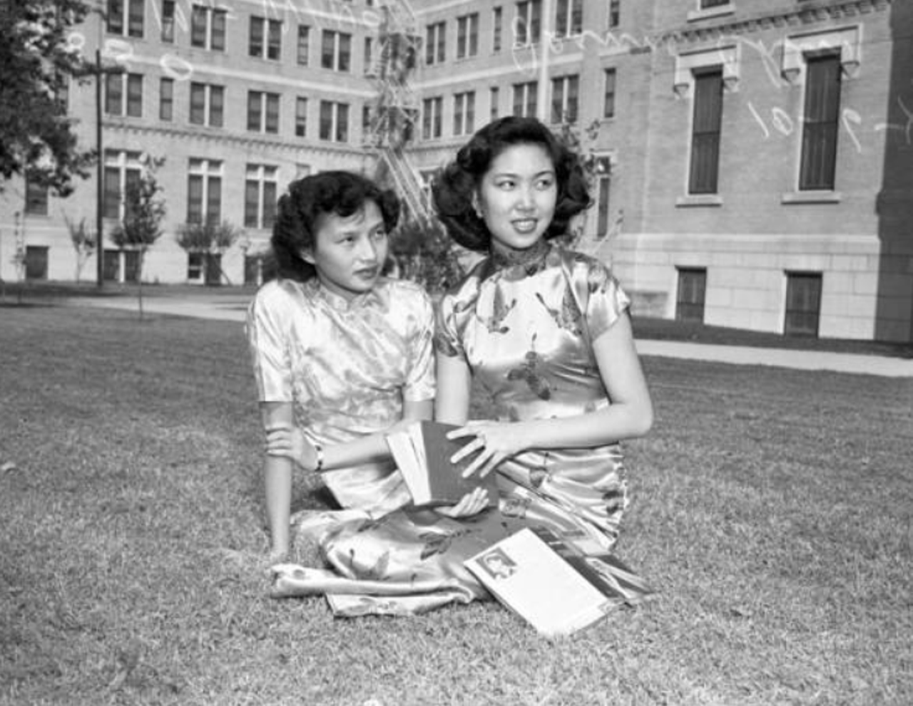 Mae Wang, left, and Jeanne Chen enjoyed a relaxing afternoon on a lawn at Our Lady of the Lake University. The two attended the university thanks to a four-year scholarship through an overseas student service.