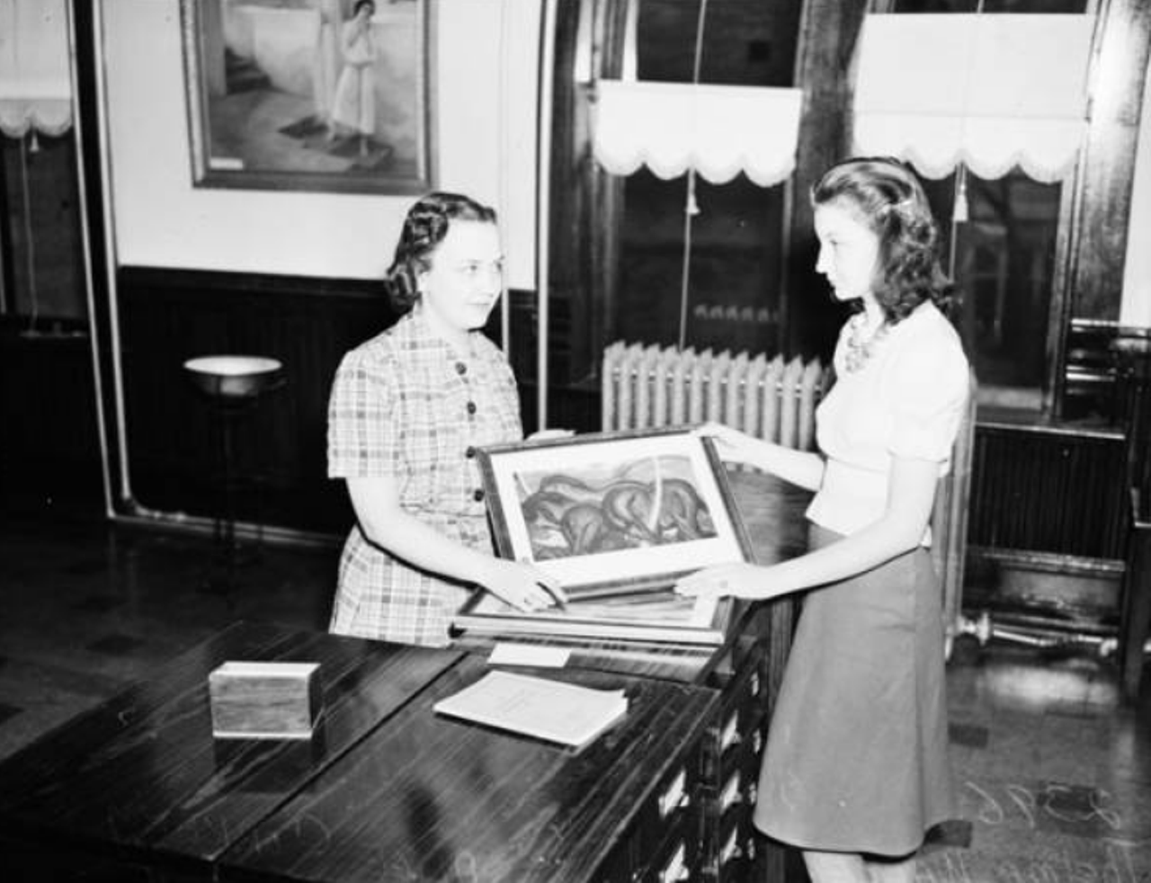 Our Lady of the Lake librarian Alice Corkery was super excited to show off pictures in the campus' then-new art library back in 1940.
