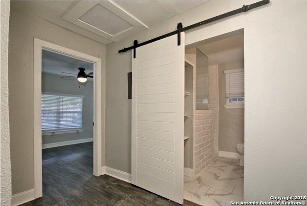 Sure, there's only one bathroom, but it has this super cool barnyard-style sliding door.