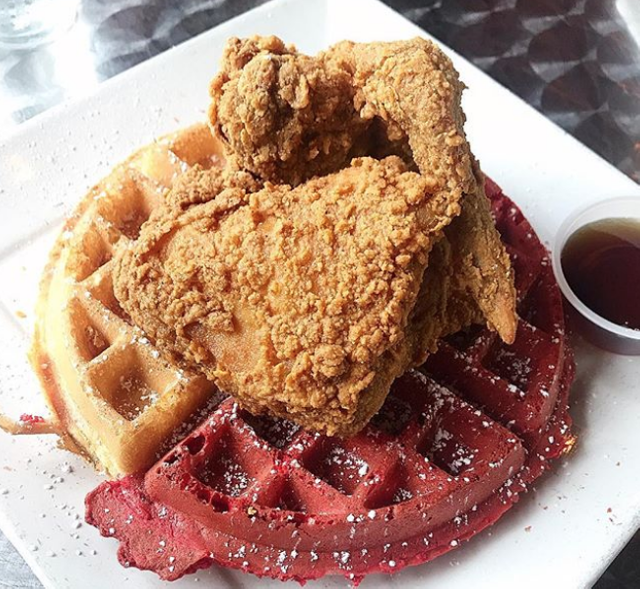 The South Chicken & Waffles
Multiple locations, thesouthsa.com
Prized for its chicken and waffles (duh) available with the original waffle or red velvet, The South has been serving up this goodness since its first location opened in 2017. You can thank owner Joshua Green for such deliciousness. Chicken lovers on-the-go can also score the same bites at the “express” location, which opened in 2018. The menu showcases other Southern treats such as Orleans oxtail grillades and a variety of grits pairings.
Photo via Instagram / foodiefeng