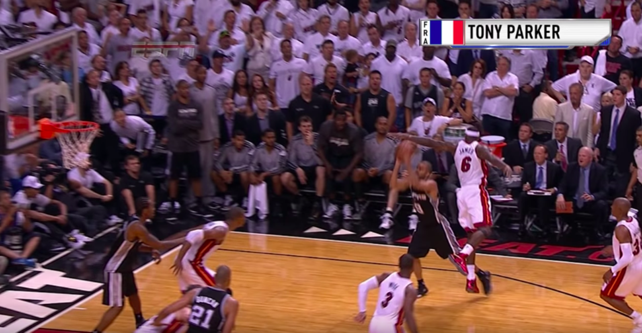 His buzzer-beater during the 2013 Finals.
While Spurs fans are still bitter about how the 2013 championships ending, Game 1 of the series will always be a positive memory. At the end of the first game, Parker — through LeBron James, no less — scored the winning shot. Never forget.
Photo via YouTube / NBA