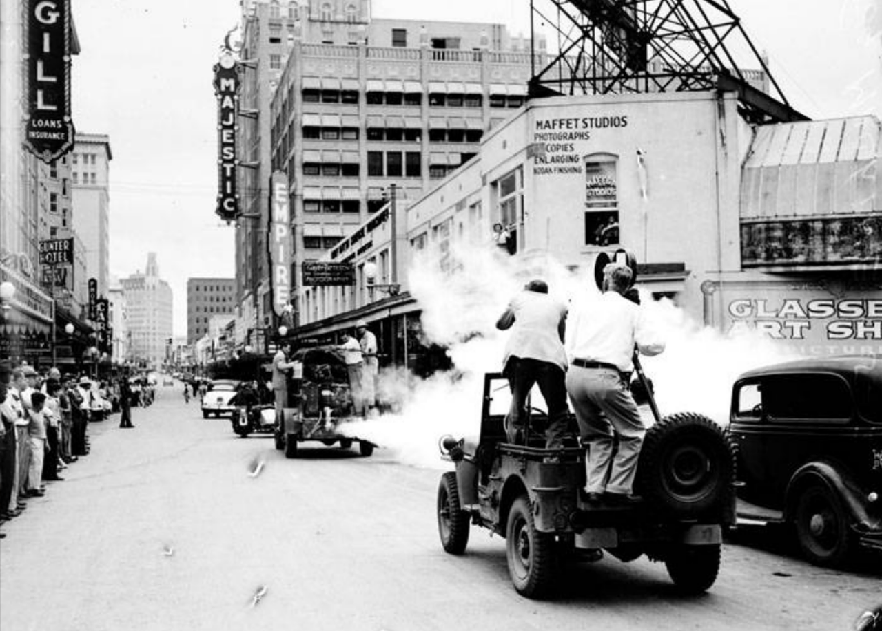 In 1946, a photo studio was down the street from the Majestic and Empire theatres. This photo shows a portable "fog" machine that allowed crewmen to spray insecticide throughout what was called the business and theatre districts. Don't worry, the city said this was super safe to residents' health.
