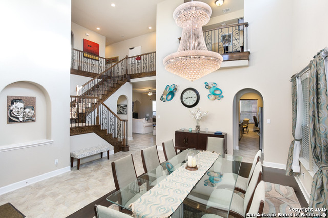 As soon as you walk into the home, you'll see a grand staircase and a breathtaking crystal chandelier.