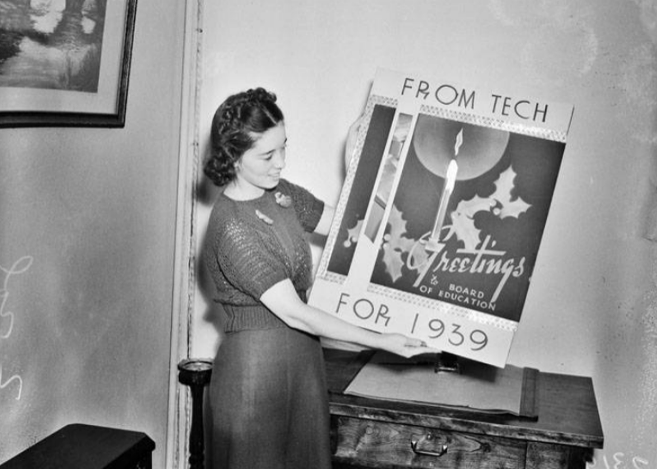 Here you can see Madge Brown holding up an oversized Christmas card in 1939. It was sent to the San Antonio Board of Education from students and faculty of Tech High School. Aww!