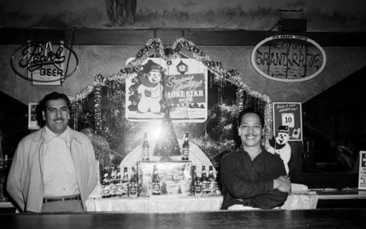 Even boozy spots got into the Christmas spirit. You can see some decorations up at this unnamed bar in December 1954.