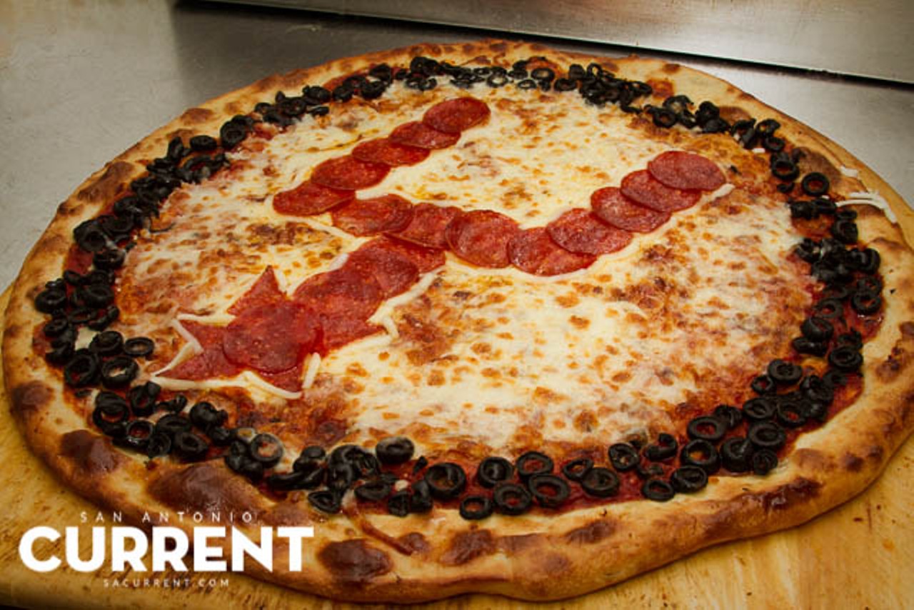 Spurs logo pizza with black olives and pepperoni