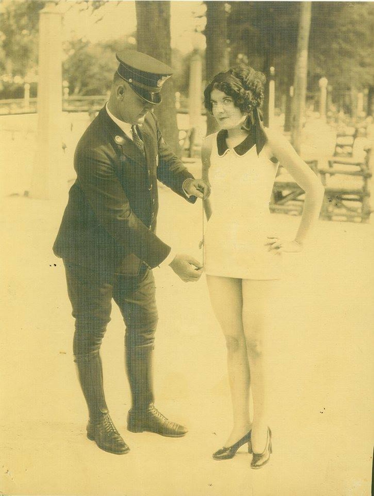 Policeman Measures Lady's Swimsuit at San Pedro Springs Pool
An SAPD officer measures Miss San Antonio 1927's bathing suit to see if it's in accordance with city ordinance. What a square. 
Vintage San Antonio