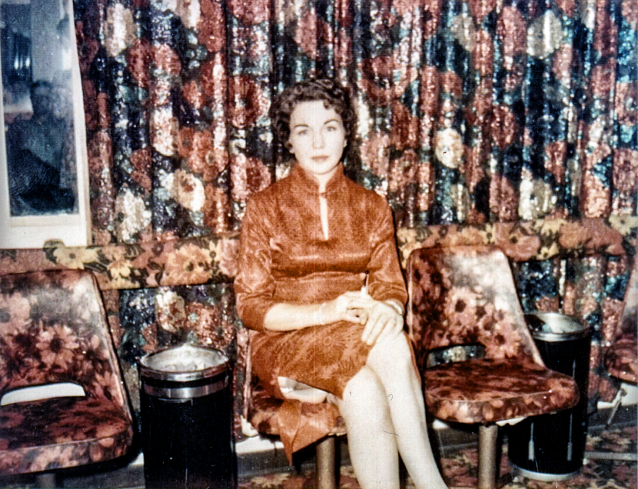 Edna Milton in the uniquely decorated parlor of the Chicken Ranch. Commercial ashtrays were strategically positioned after every second chair. Courtesy of Edna Milton Chadwell