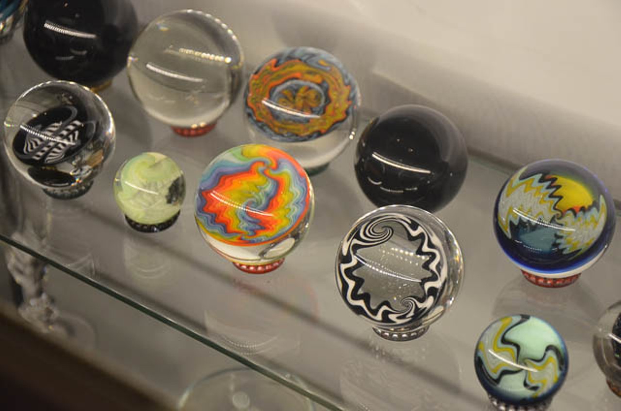 Craft hand-blown glass marbles on display at Zollie Glass Studio's gallery at Blue Star