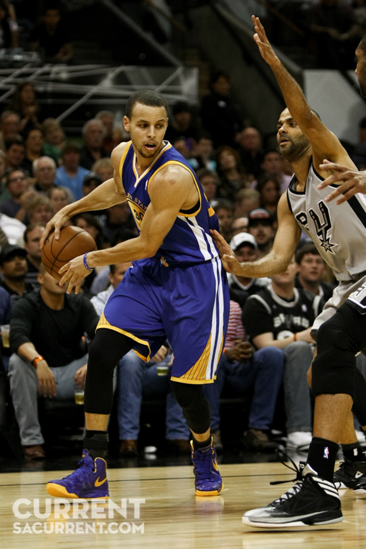 Golden State's Stephen Curry passes behind his back past San Antonio's Tony Parker during the 1st half of Game 5 of the Western Conference Semi-Final Playoff series on Tuesday May 14th, 2013 in San Antonio, Texas (Josh Huskin / www.joshhuskin.com)