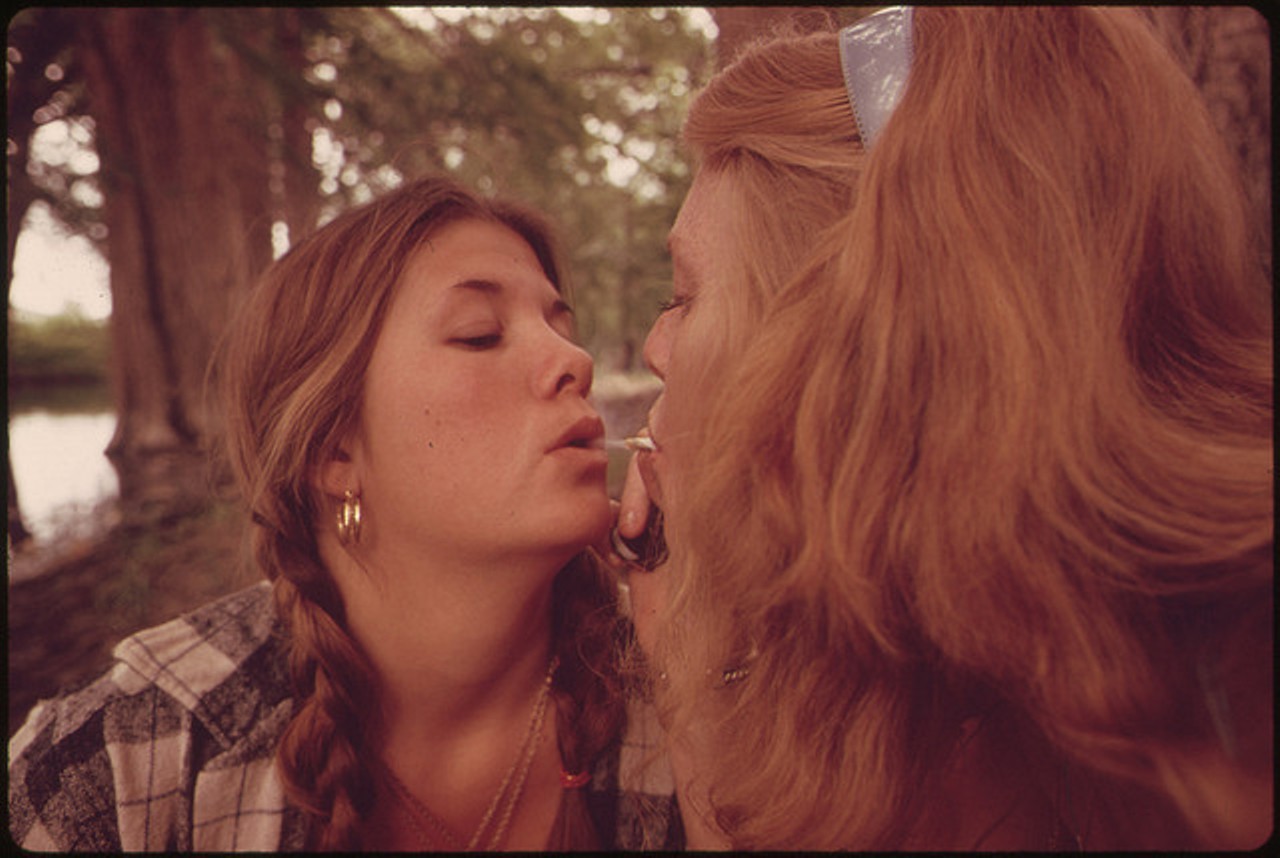 Two Girls Smoking Pot During an Outing in Cedar Woods near Leakey, Texas. (Taken with Permission)