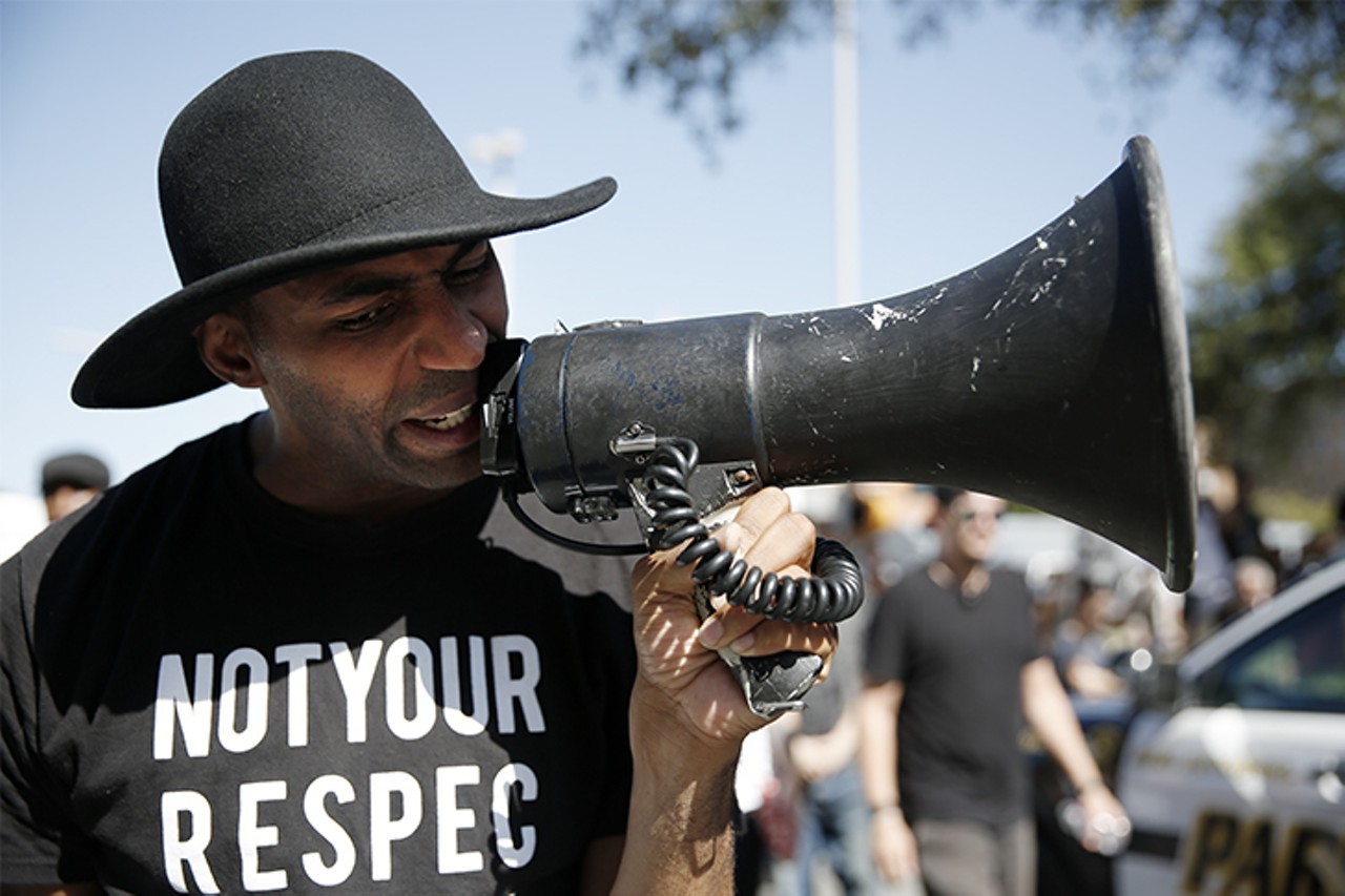Protestors armed and ready for confrontation met Saturday, Aug. 12, 2017, at Travis Park in San Antonio. The protests began in response to talks of taking the confederate statue, which stands in the center of the park, be taken down in city council. Counterprotestors matched the nationalists with microphones and bandanas to conceal identity.