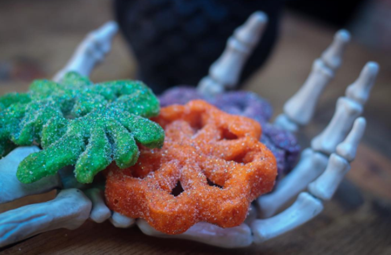 SA Buñuelo Co.
(210) 835-5137, sabuneloco.com
SA Buñuelo Co. has buñuelos shaped as creepy spiders and webs in purple, green, and orange that are sure to put you in the Halloween spirit. Visit them on Insta to place your order. 
Photo via Instagram, sabunueloco