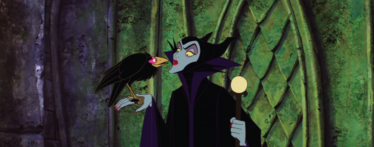 Maleficent, Sleeping Beauty (1959)
Despite the incredibly unsavory green pallor of her skin and creepy crow sidekick, Malleficent's horned headwear gives her away as being pretty evil. Well, that and the fact that she curses a baby within the first 20 minutes of the movie. Would an abuela ever do that? I don’t want to find out.
Photo via Sleeping Beauty / Facebook