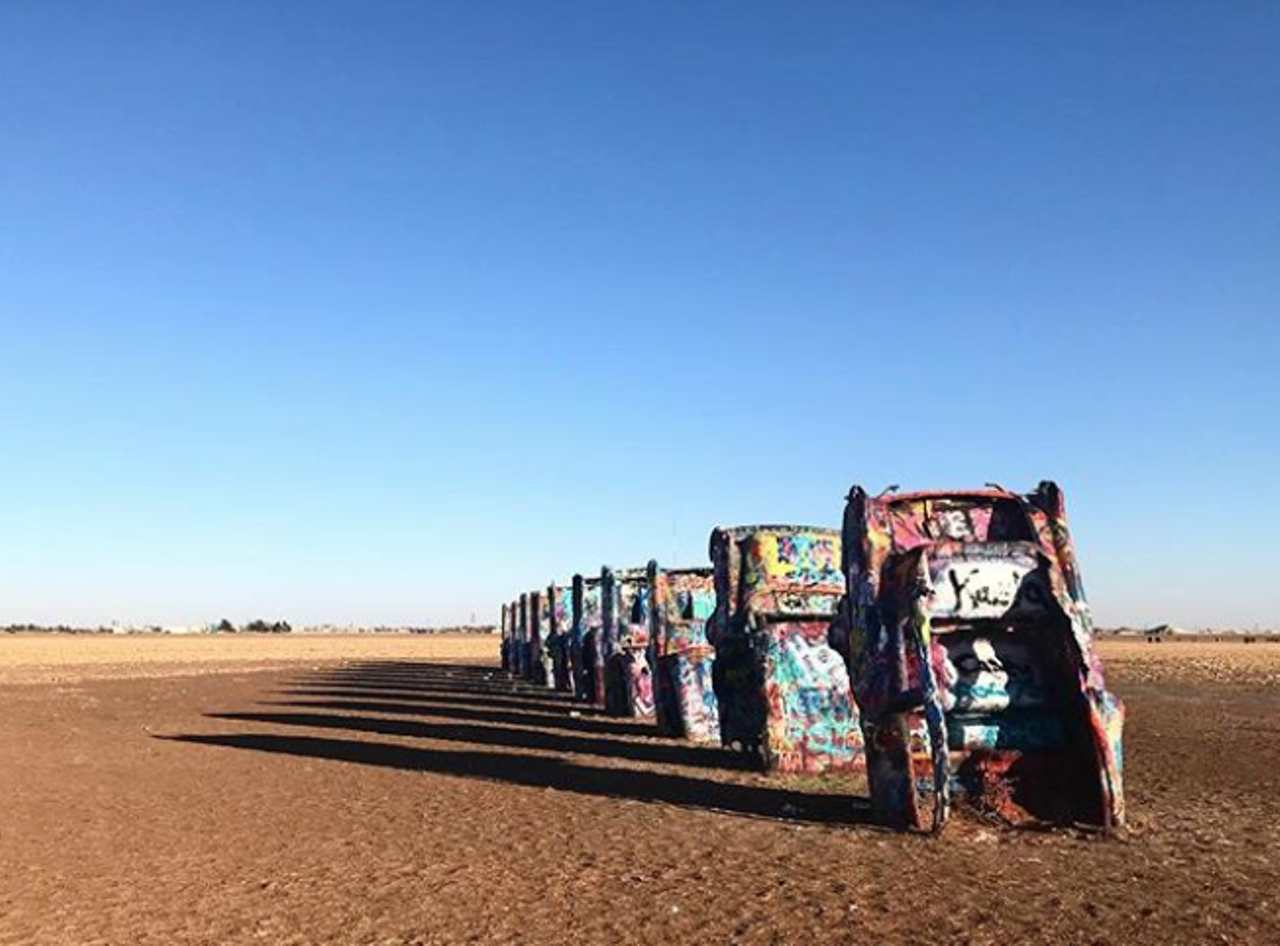 Cadillac Ranch
13651 I-40 Frontage Rd, Amarillo
This public art installation is a famous one out in Amarillo. Dating back to 1974, artists Chip Lord, Hudson Marquez and Doug Michels took junk Cadillacs to show the evolution of the car line from 1949 to 1963. Now, the half-buried nose-first cars welcome visitors to add to the art with their own graffiti.
Photo via Instagram / mommaminser