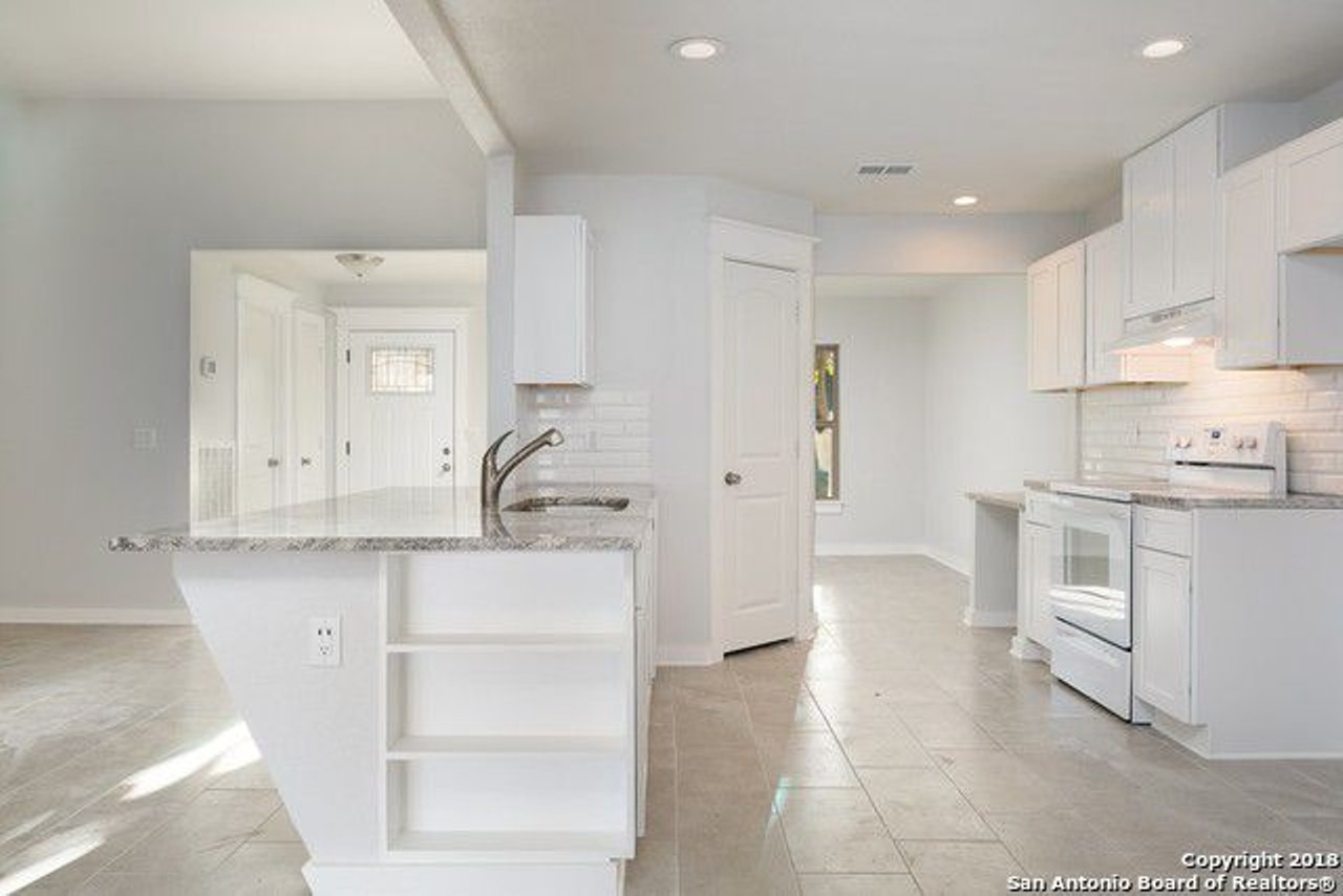 The kitchen, with all new appliances and an electric stove, offer plenty of space for organization.