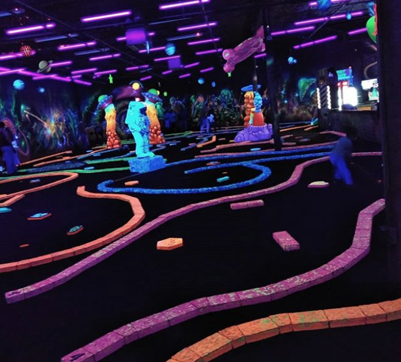Practice your aim at Cosmic Mayhem Black Light Mini Golf
903 E Bitters Road, Suite 310, (210) 437-1072, cosmicmayhem.com
Head to Cosmic Mayhem to cause some mayhem while you wait out the rain. No, not really, but you can get in a few rounds of mini golf in this blacklight course. You can also enjoy drinks at the space-themed beer and wine bar between rounds.
Photo via Instagram / amberrosehernandez