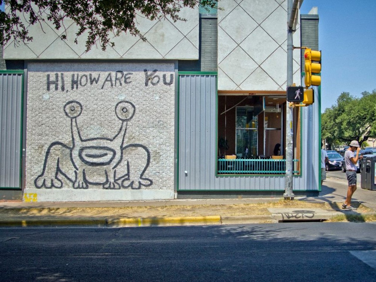 Hi, How Are You
Intersection of W. 21st and Guadalupe Streets, Austin
Also called "Jeremiah the Innocent," Daniel Johnston's iconic 1993 mural was originally painted on the side of Austin's Sound Exchange music store. In 2023, developers demolished the building on which the mural was painted, but left it standing and promised to preserve the artwork.