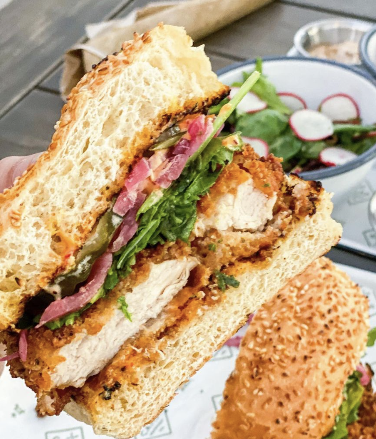Camp Outpost
1811 S Alamo St, (210) 942-4690,  eatatcamp.com 
The tender fried chicken is not the only thing to love about this sandwich. Calabrian chile aioli, pickled red onions and arugula combine to offer big flavor in each and every bite. 
Photo via Instagram / stine.eats