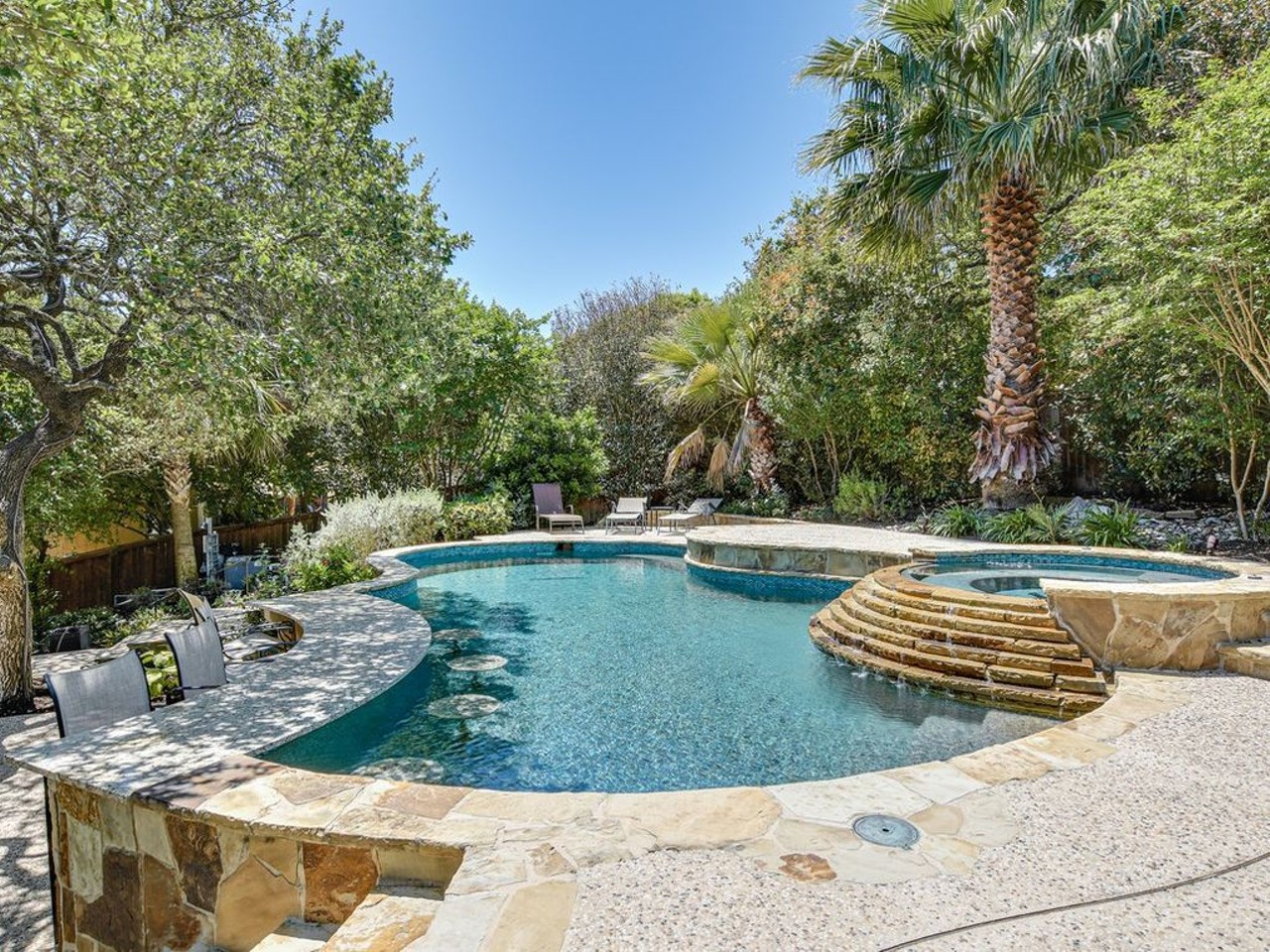 2915 Ivory Crk
$839,900
With stools underwater to sit on, all this pool is missing is the bartender to serve drinks at this stay-at-home poolside bar.