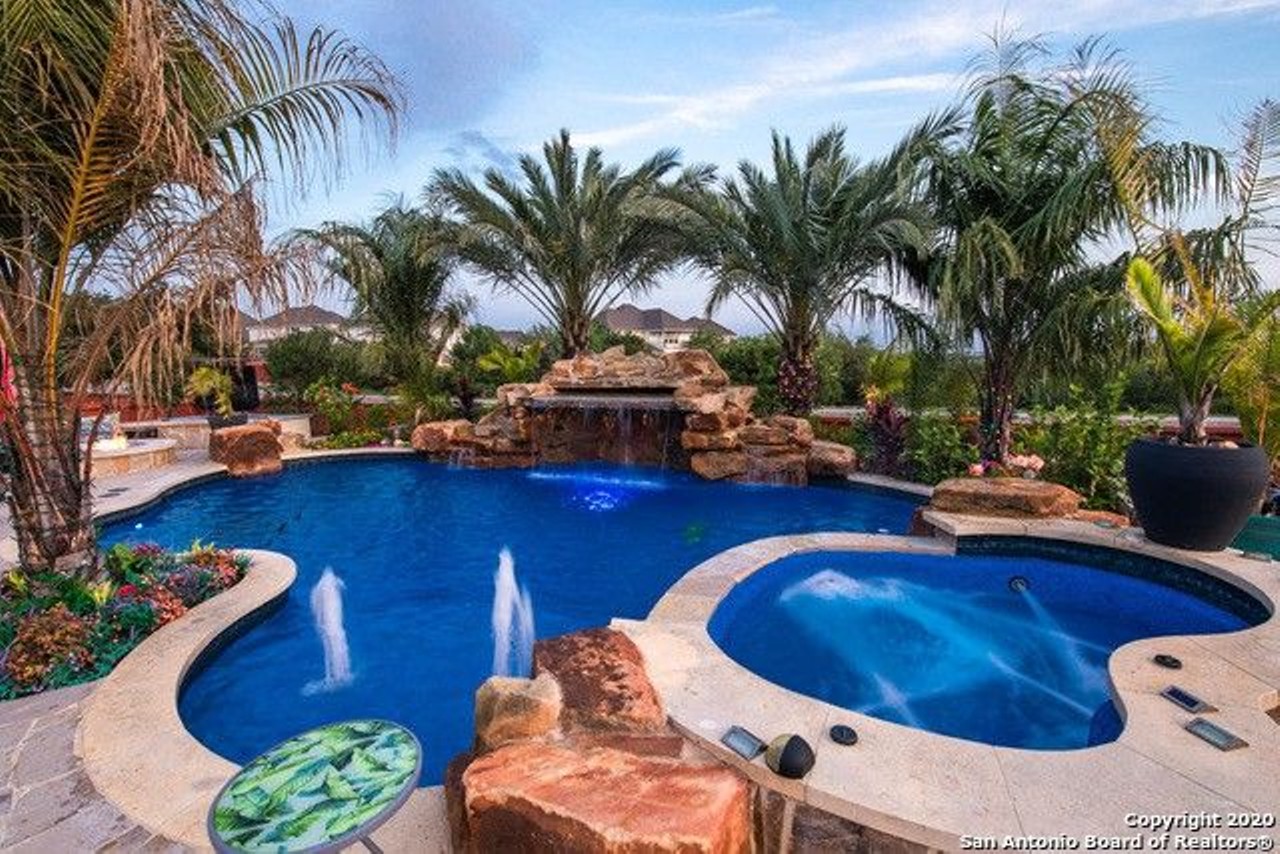12526 Tersk
$798,950
The rocky waterfall, cerulean blue water and copious palm trees make this pool a real tropical getaway.
