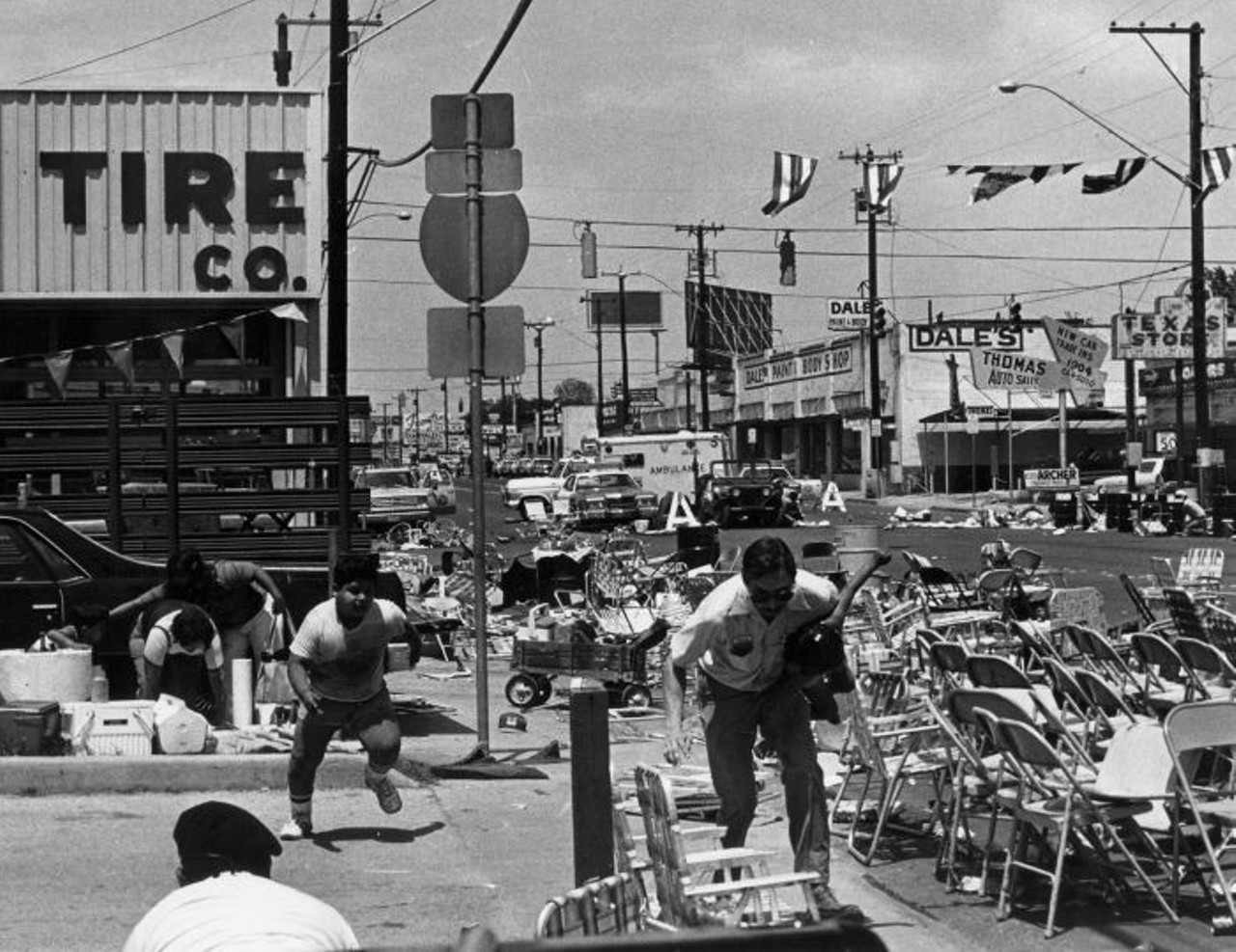 The Shooting at the 1979 Battle of Flowers Parade
April 27, 1979. The darkest Battle of Flowers parade in San Antonio history brough hysteria to the streets after a man – 64-year-old Ire Attebury – opened fire during the Fiesta celebration. The veteran had stockpiled guns and ammunition in his motor home parked nearby and shot throughout the scene for about 30 minutes. Initially he had shot six police officers, but by the end of the incident he had killed two women – Amelia Castillo and Ida Dollard – and injured more than 50 attendees. Attebury was later found inside the motor home. Investigators are still unsure whether his own bullet or a shot from an officer was the one that killed him.
Photo by Al Guzman for San Antonio Light